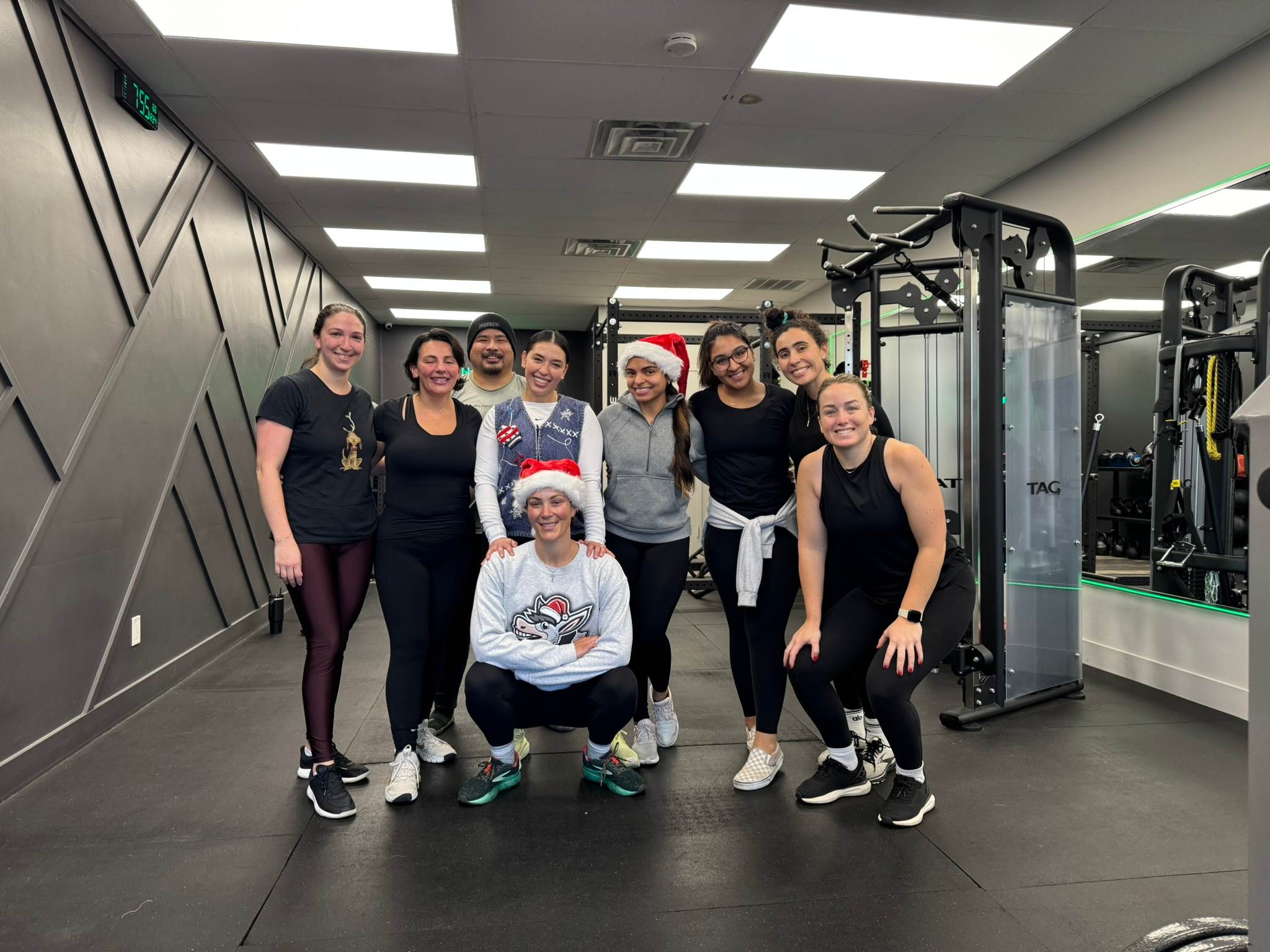 Members and coaches of Balanced Health Fitness together on the studio floor in Seaford, NY.